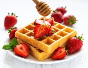 waffles dorados con frutas frescas y miel